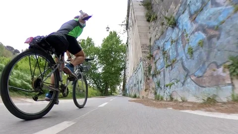 VR360 Extreme POV effect A biker rides on the bicycle lane Along the river Rome Stock Footage 107136102