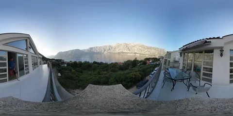 VR360. Guy on the balcony of the villa overlooking the Bay of Kotor. Montenegro Stock Footage 90294115
