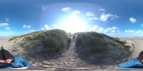VR360, Man hiking on sandy beach, storm on the North Sea, VR Stock Footage 117716442