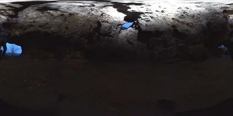 VR360, Man with lamp in a dark rock cave Stock Footage 120640157