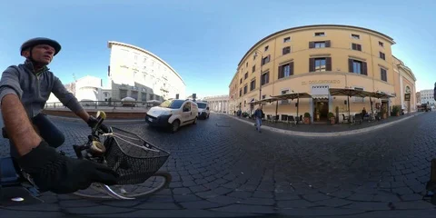 VR360 A man ride a bike trough the colonnade St Peter square Stock Footage 106574500