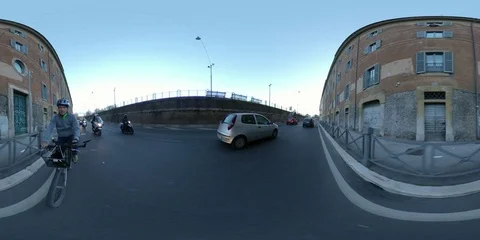 VR360 A man rides a Bike at sunset in the ancient Rome - Porta Portese Stock Footage 106576129