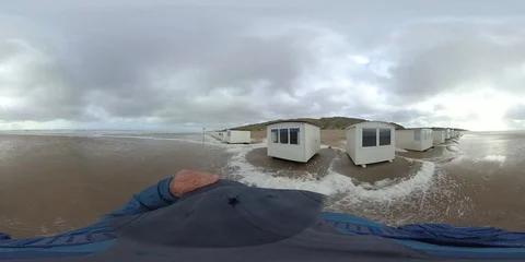 VR360, Man runs in storm on the beach, North Sea, algal foam, VR Stock Footage 117712400