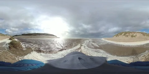 VR360, Man runs in storm on the beach, North Sea, algal foam, VR Stock Footage 117713657
