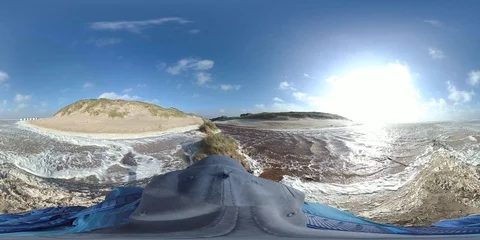 VR360, Man runs in storm on the beach, North Sea, algal foam, VR Stock Footage 117714691