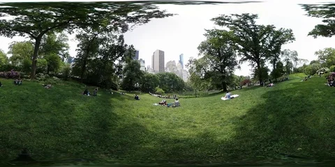 VR360. New Yorkers are resting on a grassy lawn in the Central Park. USA Stock Footage