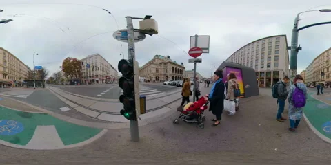 VR360 People going green light, crossing road, Vienna State Opera on backdrop Stock Footage 104107325