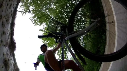 VR360 POV effect A biker rides on the bicycle lane Along the river Rome Stock Footage 107444631