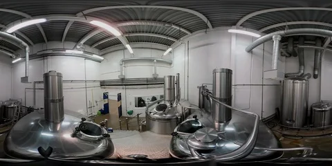 VR360. Taking a sample of beer wort from the large steel vat at the brewhouse. Stock Footage 90447434