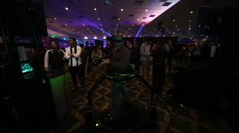 VRLA Expo - Man in Virtuix Omni VR Treadmill Stock Footage 59581320
