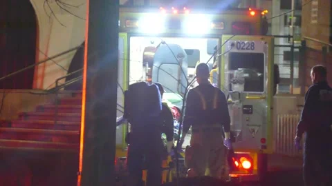 VSA victim loaded in ambo Stock Footage 138542203