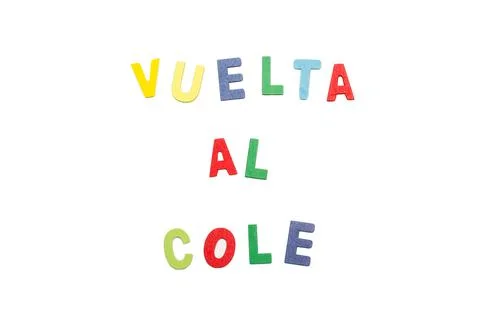 Vuelta al cole write with colored toy wooden letters on a white background 스톡 사진