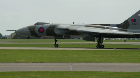 Vulcan bomber slowly moving down runway Stock Footage 41345909