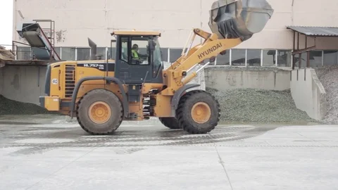 Вulldozer pushes garbage into depot cell 動画素材 72857902