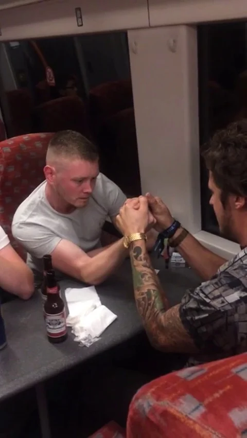 VV1576 Reverse arm wrestle prank Stock-Footage 129462404