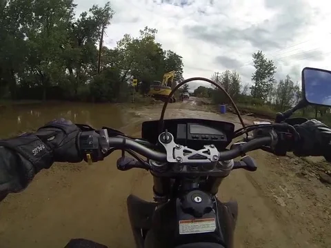 VV165  Flash Flood in Boulder takes motorcyclist on a dangerous ride Stock-Footage 129461079