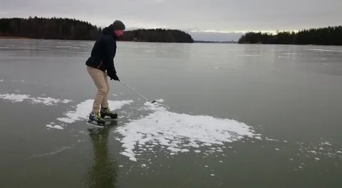 VV1733 Having a round of golf on ice Stock-Footage 129455113