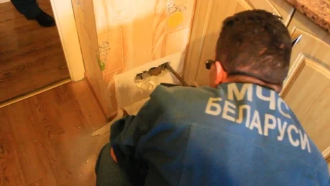 VV1940 Cat trapped in wall gets rescued Stock-Footage 129458907