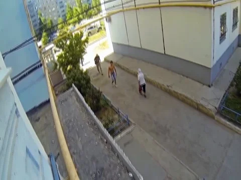VV2368 - Guy climbs up the side of a building to visit his friend Stock-Footage 129454663