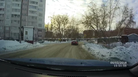 VV2825 Guy slips on icy road near car Stock Footage 129461971