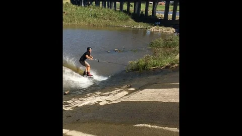 VV3113 Wakeboarding log jump fail Stock-Footage 129405472