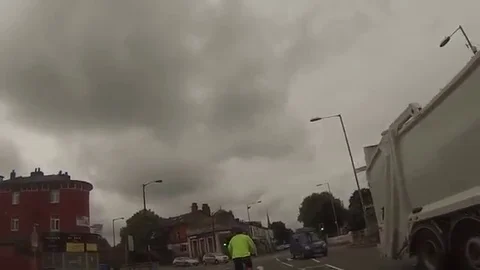 VV959 Driver cuts down cyclist but doesnt care! Stock-Footage 129461398