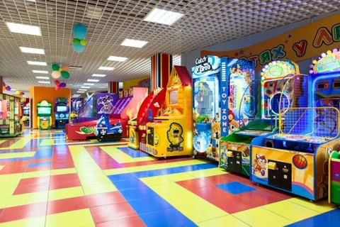 VYBORG, RUSSIA-CIRCA SEP, 2013: Empty colorful kid zone with arcade game mach Stock Photos