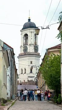 Vyborg, view of the medieval Clock Tower from the old city street. Stock Photos