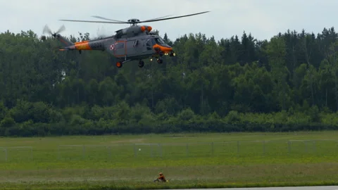 W-3T helicopter doing maneuvers at air show in Gdynia Stock Footage 136487634