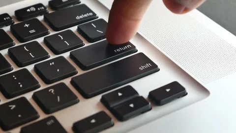 W motion of forefinger pressing enter key on modern laptop Stockbeeldmateriaal 291854411