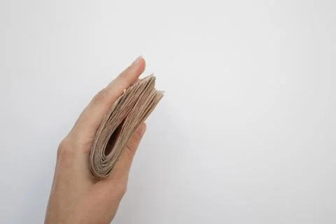 A wad of banknotes in hand Stock Photos