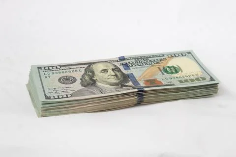 A wad of dollars on a white isolated background Stock Photos