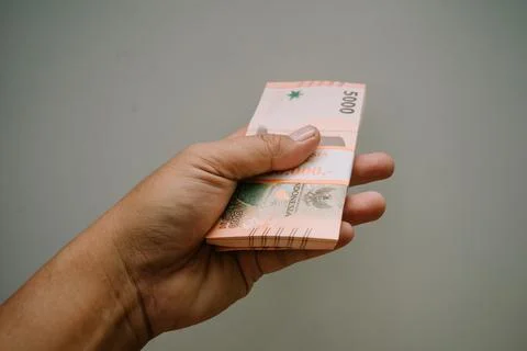 A wad of five thousand rupiah will be ready to be distributed to several ch.. 写真素材