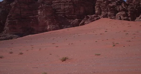 Wadi Rum Drone DJI 4K - Red sand trails to mountain Stock Footage 90289441