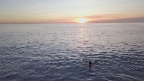 Wading in Ocean at Sunset 스톡 동영상 83899718