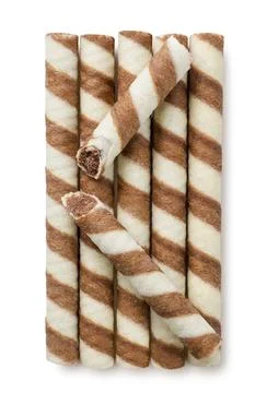 Wafer rolls and a broken on a white background. Top view Stock Photos