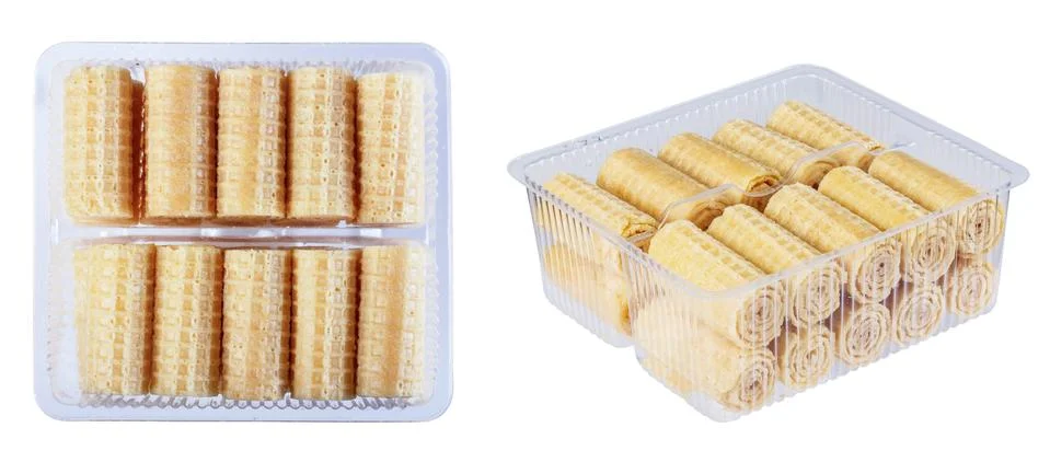 Wafer rolls in a plastic container, isolate on a white background in various Stock Photos