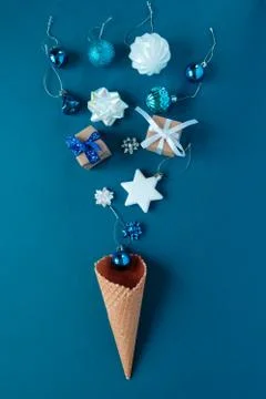 Waffle cone with christmas elements on blue background. Holiday concept. 写真素材