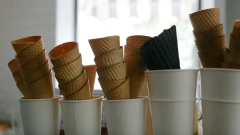 Waffle cones are a stack. Camera movement from right to left, real time, indoor, Stock Footage 93514469