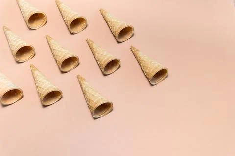 Waffle cones on a beige background in a diagonal pattern Stock Photos