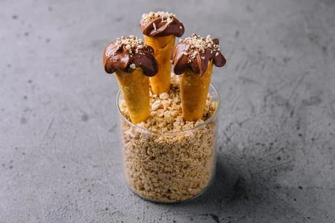 Waffle cones with hazelnuts and chocolate cream Stock Photos