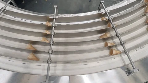 Waffle cones rotate in separate equipment compartments Stock-Footage 124299408