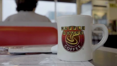 Waffle House-Coffee Cup-v1-Family is Seated in Background 스톡 동영상 95018317