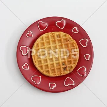 Waffle on red plate with hearts Stock Photos