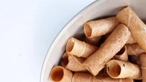 Waffle Rolls, snacks in ceramic cups Stock Photos