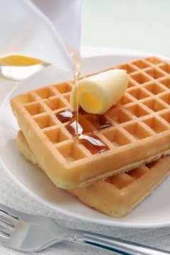 Waffles and maple syrup Stock Photos