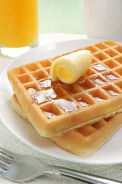Waffles and maple syrup Stock Photos