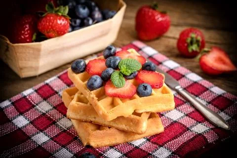 Waffles with berries. Stock Photos