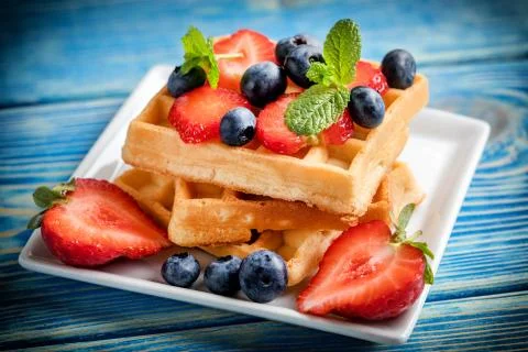 Waffles with berries. Stock Photos