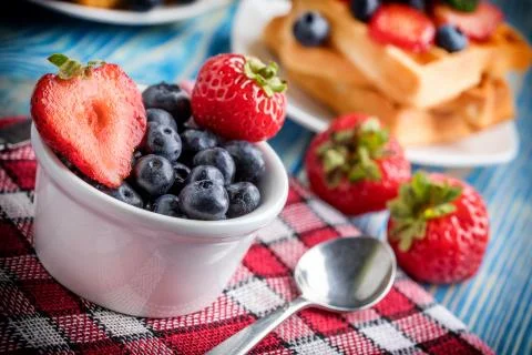 Waffles with berries. Stock Photos